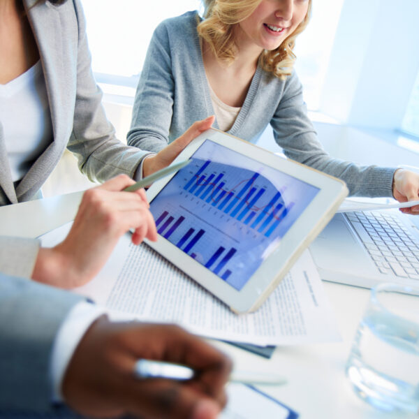close up female executive with digital tablet scaled